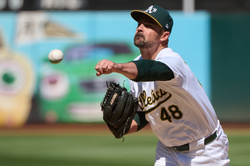 Sep 7, 2024; Oakland, California, USA; Oakland Athletics pitcher T.J. McFarland (48) throws a pitch against the Detroit Tigers during the seventh inning at Oakland-Alameda County Coliseum. Mandatory Credit: Robert Edwards-Imagn Images