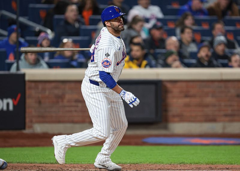 Apr 26, 2024; New York City, New York, USA;  New York Mets designated hitter J.D. Martinez (28) hits an RBI double during the sixth inning against the St. Louis Cardinals at Citi Field. Mandatory Credit: Vincent Carchietta-USA TODAY Sports