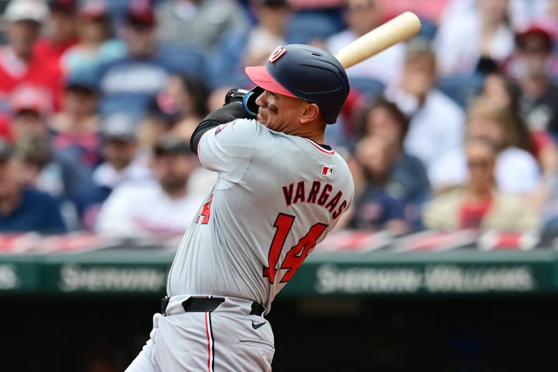 Jun 2, 2024; Cleveland, Ohio, USA; Washington Nationals shortstop Ildemaro Vargas (14) hits an RBI single during the second inning against the Cleveland Guardians at Progressive Field. Mandatory Credit: Ken Blaze-USA TODAY Sports