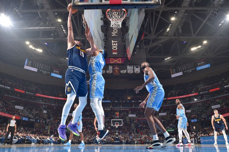 CLEVELAND, OH - DECEMBER 8: Nikola Jokic #15 of the Denver Nuggets drives to the basket during the game against the Cleveland Cavaliers on December 5, 2024 at Rocket Mortgage FieldHouse in Cleveland, Ohio. NOTE TO USER: User expressly acknowledges and agrees that, by downloading and/or using this Photograph, user is consenting to the terms and conditions of the Getty Images License Agreement. Mandatory Copyright Notice: Copyright 2024 NBAE (Photo by David Liam Kyle/NBAE via Getty Images)