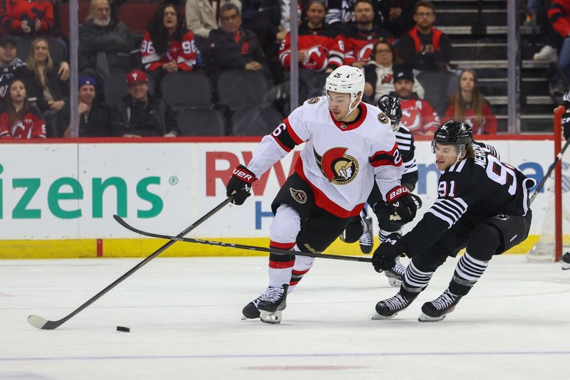 Mar 23, 2024; Newark, New Jersey, USA; Ottawa Senators defenseman Erik Brannstrom (26) skates with the puck while being defended by New Jersey Devils center Dawson Mercer (91) during the third period at Prudential Center. Mandatory Credit: Ed Mulholland-USA TODAY Sports