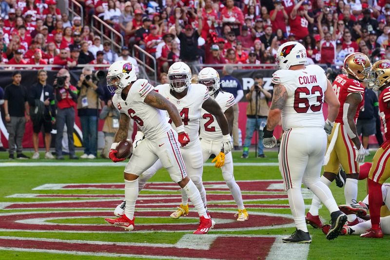 Arizona Cardinals running back James Conner (6) celebrates after scoring against the San Francisco 49ers during the first half of an NFL football game Sunday, Dec. 17, 2023, in Glendale, Ariz. (AP Photo/Ross D. Franklin)