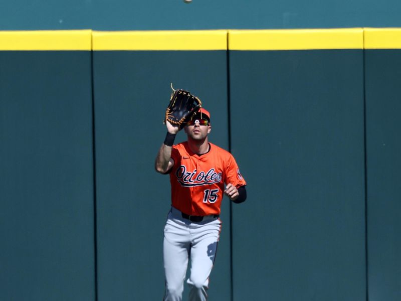 Feb 26, 2025; Bradenton, Florida, USA; Baltimore Orioles outfielder Dylan Carlson (15) catches a fly ball against the Pittsburgh Pirates during the fourth inning at LECOM Park. Mandatory Credit: Kim Klement Neitzel-Imagn Images