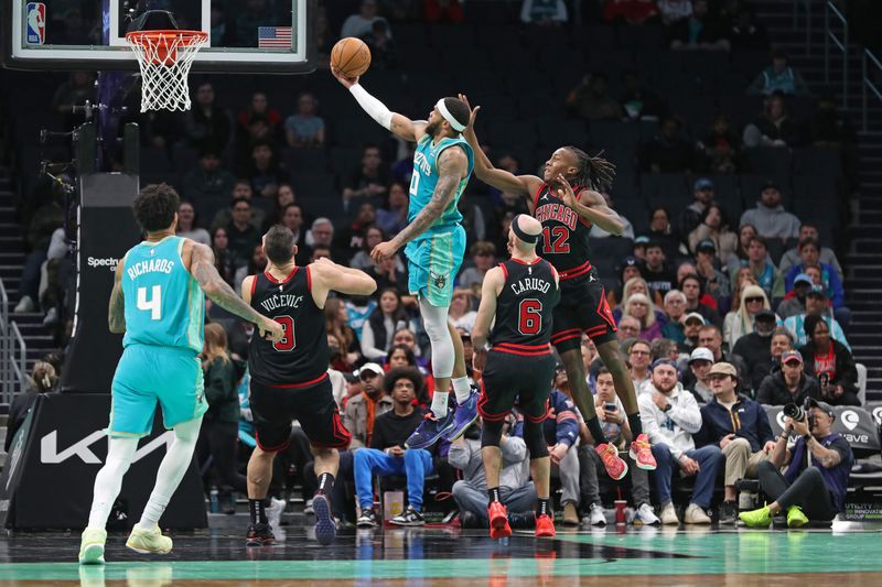 CHARLOTTE, NC - JANUARY 31: Miles Bridges #0 of the Charlotte Hornets shoots the ball during the game against the Chicago Bulls on January 31, 2024 at Spectrum Center in Charlotte, North Carolina. NOTE TO USER: User expressly acknowledges and agrees that, by downloading and or using this photograph, User is consenting to the terms and conditions of the Getty Images License Agreement.  Mandatory Copyright Notice:  Copyright 2024 NBAE (Photo by Brock Williams-Smith/NBAE via Getty Images)