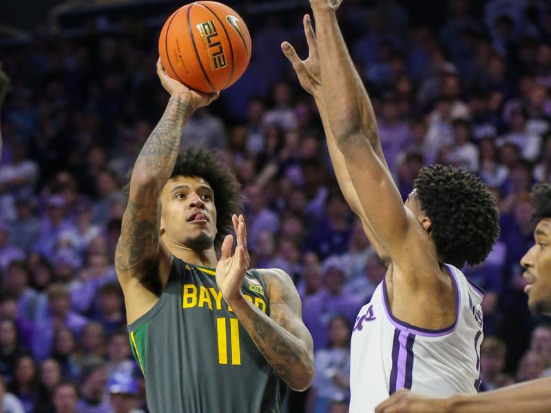 Jan 16, 2024; Manhattan, Kansas, USA; Baylor Bears forward Jalen Bridges (11) shoots against Kansas State Wildcats forward David N'Guessan (1) during the second half at Bramlage Coliseum. Mandatory Credit: Scott Sewell-USA TODAY Sports