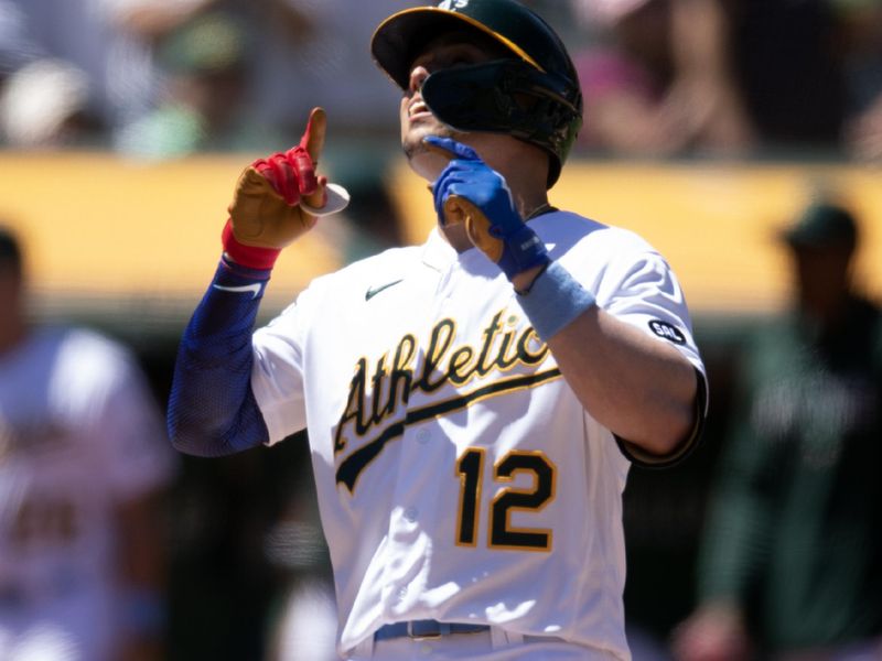 Jun 18, 2023; Oakland, California, USA; Oakland Athletics shortstop Aledmys D  az (12) celebrates his solo home run against the Philadelphia Phillies during the seventh inning at Oakland-Alameda County Coliseum. Mandatory Credit: D. Ross Cameron-USA TODAY Sports
