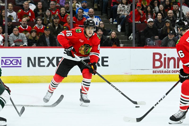 Nov 10, 2024; Chicago, Illinois, USA;   Chicago Blackhawks center Teuvo Teravainen (86) moves the puck against there Minnesota Wild  during the first period at the United Center. Mandatory Credit: Matt Marton-Imagn Images