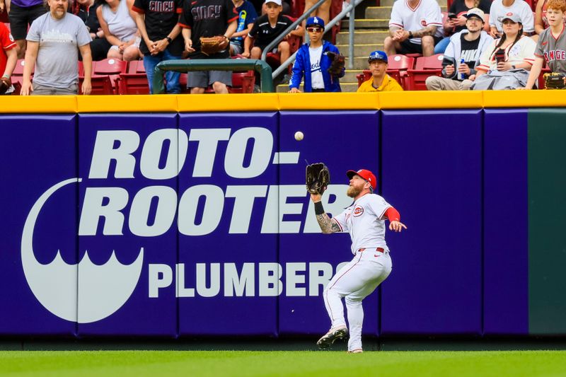 May 26, 2024; Cincinnati, Ohio, USA; Cincinnati Reds outfielder Jake Fraley (27) catches a fly out hit by Los Angeles Dodgers shortstop Mookie Betts (not pictured) in the ninth inning at Great American Ball Park. Mandatory Credit: Katie Stratman-USA TODAY Sports