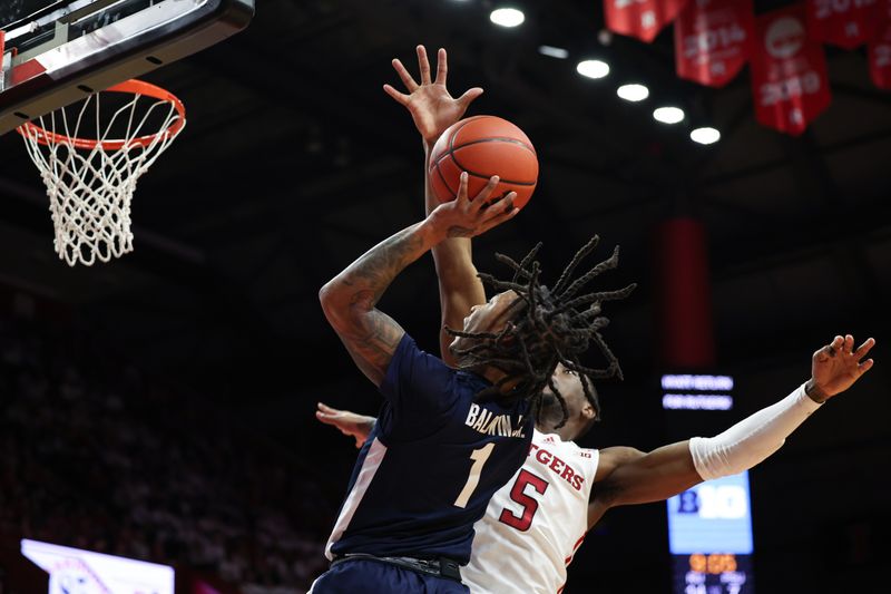 Jan 31, 2024; Piscataway, New Jersey, USA; Penn State Nittany Lions guard Ace Baldwin Jr. (1) shoots the ball as Rutgers Scarlet Knights guard Jacob Morales (15) defends during the first half at Jersey Mike's Arena. Mandatory Credit: Vincent Carchietta-USA TODAY Sports