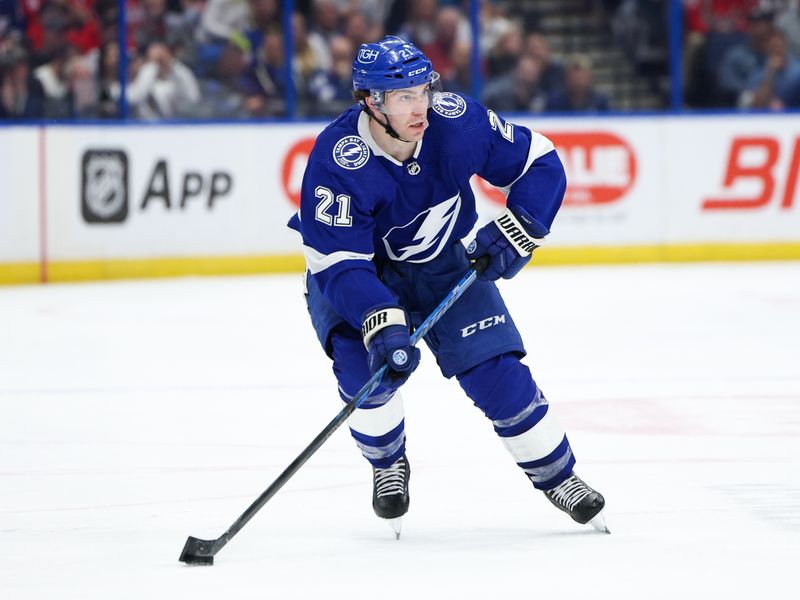 Feb 22, 2024; Tampa, Florida, USA;  Tampa Bay Lightning center Brayden Point (21) controls the puck against the Washington Capitals in the third period at Amalie Arena. Mandatory Credit: Nathan Ray Seebeck-USA TODAY Sports