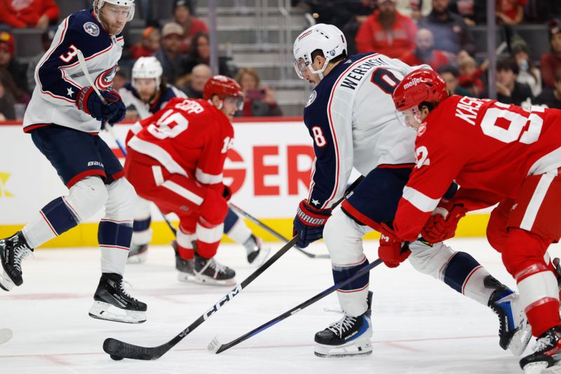 Nov 22, 2025; Detroit, Michigan, USA;  Columbus Blue Jackets defenseman Zach Werenski (8) skates with the puck celebrates Detroit Red Wings center Marco Kasper (92) in the third period at Little Caesars Arena. Mandatory Credit: Rick Osentoski-Imagn Images
