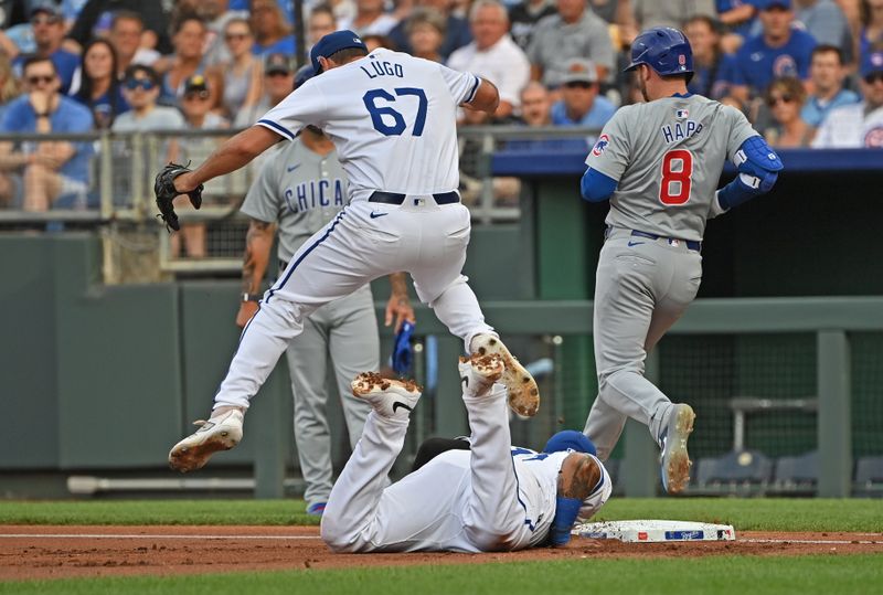 Jul 27, 2024; Kansas City, Missouri, USA;  Kansas City Royals first baseman Salvador Perez (13) dives to first base to force out Chicago Cubs left fielder Ian Happ (8), as pitcher Seth Lugo (67) leaps over him in the first inning at Kauffman Stadium. Mandatory Credit: Peter Aiken-USA TODAY Sports