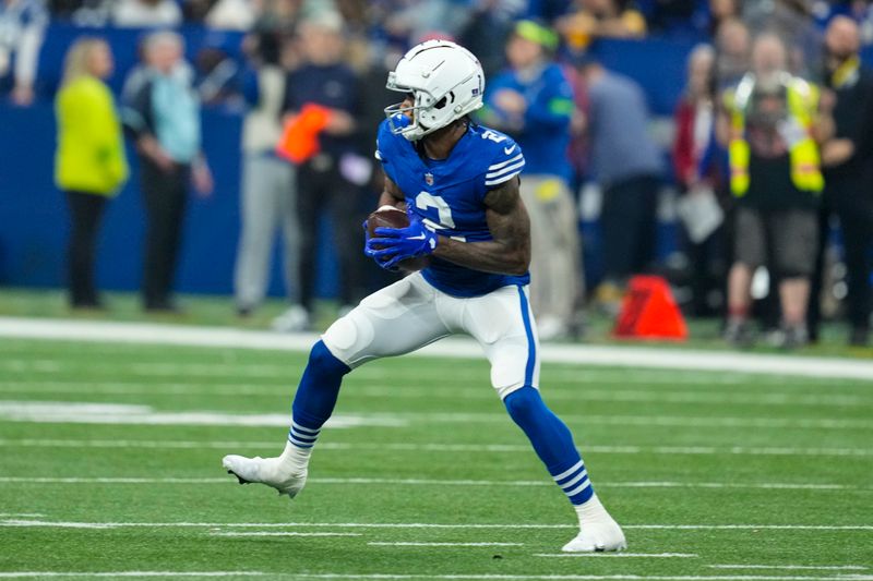 Indianapolis Colts wide receiver D.J. Montgomery (2) runs after a catch against the Pittsburgh Steelers during an NFL football game in Indianapolis, Saturday, Dec. 16, 2023. The Colts defeated the Steelers 30-13. (AP Photo/Michael Conroy)