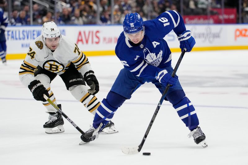 Mar 4, 2024; Toronto, Ontario, CAN; Toronto Maple Leafs forward Mitchell Marner (16) tries to get past Boston Bruins forward Jake DeBrusk (74) during the third period at Scotiabank Arena. Mandatory Credit: John E. Sokolowski-USA TODAY Sports