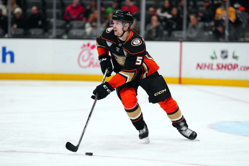 Nov 22, 2023; Anaheim, California, USA; Anaheim Ducks defenseman Urho Vaakanainen (5) skates with the puck against the Montreal Canadiens in the third period at Honda Center. Mandatory Credit: Kirby Lee-USA TODAY Sports