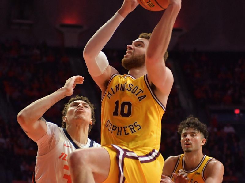 Feb 20, 2023; Champaign, Illinois, USA;  Minnesota Golden Gophers forward Jamison Battle (10) moves to the basket against Illinois Fighting Illini forward Coleman Hawkins (33) during the second half at State Farm Center. Mandatory Credit: Ron Johnson-USA TODAY Sports