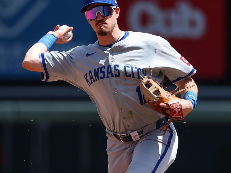 May 30, 2024; Minneapolis, Minnesota, USA; Kansas City Royals second baseman Nick Loftin (12) throws the ball to first base to get out Minnesota Twins Willi Castro (50) during the second inning at Target Field. Mandatory Credit: Matt Krohn-USA TODAY Sports