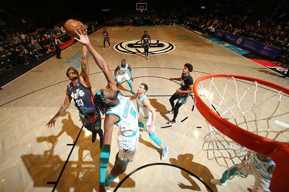 BROOKLYN, NY - NOVEMBER 30: Nicolas Claxton #33 of the Brooklyn Nets rebounds the ball during the game against the Charlotte Hornets on November 30, 2023 at Barclays Center in Brooklyn, New York. NOTE TO USER: User expressly acknowledges and agrees that, by downloading and or using this Photograph, user is consenting to the terms and conditions of the Getty Images License Agreement. Mandatory Copyright Notice: Copyright 2023 NBAE (Photo by Nathaniel S. Butler/NBAE via Getty Images)