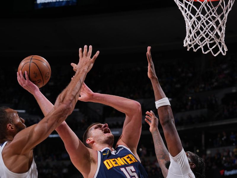 DENVER, CO - APRIL 10: Nikola Jokic #15 of the Denver Nuggets drives to the basket during the game against the Minnesota Timberwolves on April 10, 2024 at the Ball Arena in Denver, Colorado. NOTE TO USER: User expressly acknowledges and agrees that, by downloading and/or using this Photograph, user is consenting to the terms and conditions of the Getty Images License Agreement. Mandatory Copyright Notice: Copyright 2024 NBAE (Photo by Bart Young/NBAE via Getty Images)