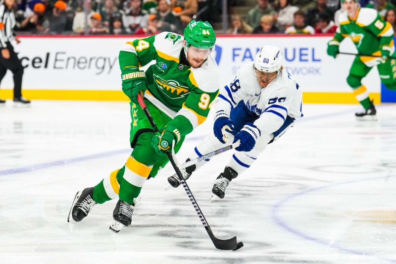 Nov 3, 2024; Saint Paul, Minnesota, USA; Minnesota Wild center Jakub Lauko (94) carries the puck during the third period against the Toronto Maple Leafs at Xcel Energy Center. Mandatory Credit: Brace Hemmelgarn-Imagn Images