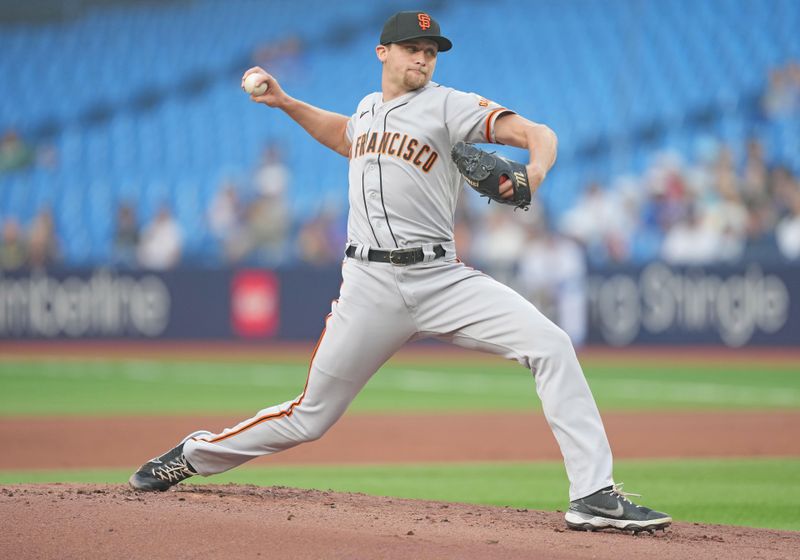 Jun 29, 2023; Toronto, Ontario, CAN; San Francisco Giants starting pitcher Keaton Winn (67) throws a pitch against the Toronto Blue Jays during the first inning at Rogers Centre. Mandatory Credit: Nick Turchiaro-USA TODAY Sports