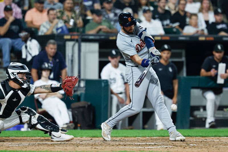 Aug 23, 2024; Chicago, Illinois, USA; Detroit Tigers outfielder Matt Vierling (8) hits an RBI-single against the Chicago White Sox during the seventh inning at Guaranteed Rate Field. Mandatory Credit: Kamil Krzaczynski-USA TODAY Sports