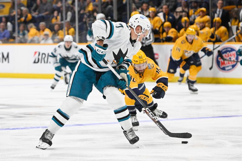 Oct 21, 2023; Nashville, Tennessee, USA; San Jose Sharks center Nico Sturm (7) skates against the Nashville Predators during the second period at Bridgestone Arena. Mandatory Credit: Steve Roberts-USA TODAY Sports