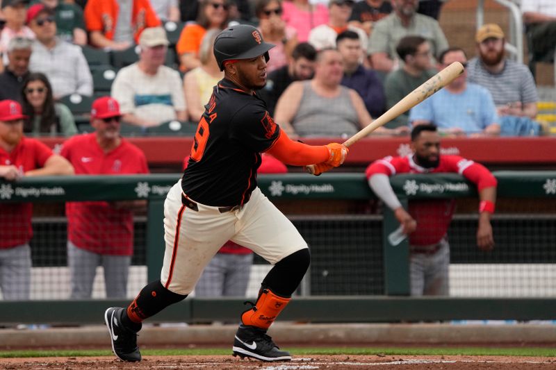 Feb 26, 2024; Scottsdale, Arizona, USA; San Francisco Giants second baseman Thairo Estrada (39) hits a single against the Los Angeles Angels in the first inning at Scottsdale Stadium. Mandatory Credit: Rick Scuteri-USA TODAY Sports