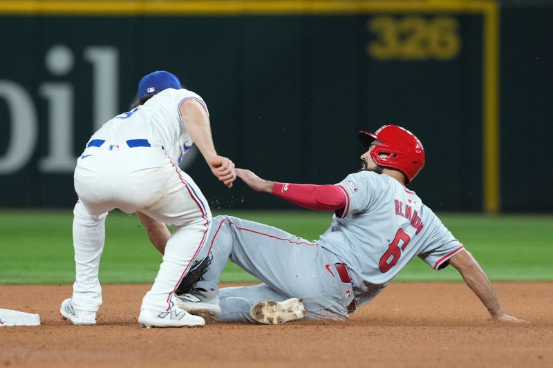 Sep 7, 2024; Arlington, Texas, USA; Texas Rangers short stop Josh Smith (8) forces out Los Angeles Angels third baseman Anthony Rendon (6) during the eighth inning at Globe Life Field. Mandatory Credit: Jim Cowsert-Imagn Images