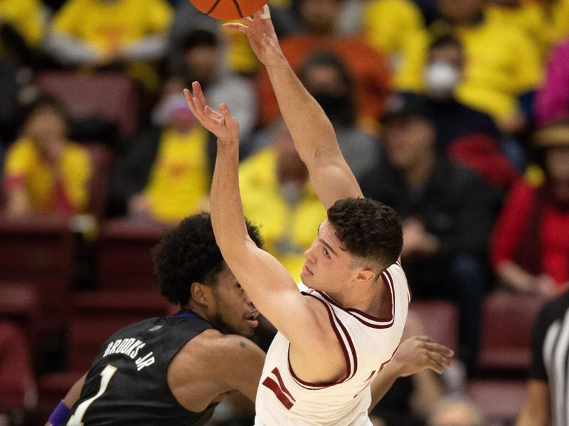 Feb 26, 2023; Stanford, California, USA; Stanford Cardinal guard Michael O'Connell (5) passes away from defensive pressure by Washington Huskies forward Keion Brooks Jr. (1) during the first half at Maples Pavilion. Mandatory Credit: D. Ross Cameron-USA TODAY Sports