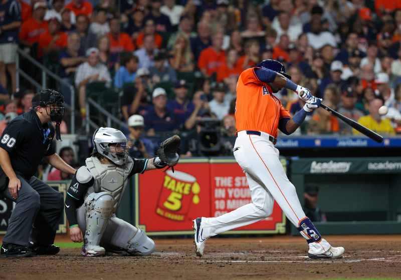 Sep 6, 2024; Houston, Texas, USA; Houston Astros left fielder Jordan Alvarez (44) hits a three run home run against the Arizona Diamondbacks in the fifth inning at Minute Maid Park. Mandatory Credit: Thomas Shea-Imagn Images