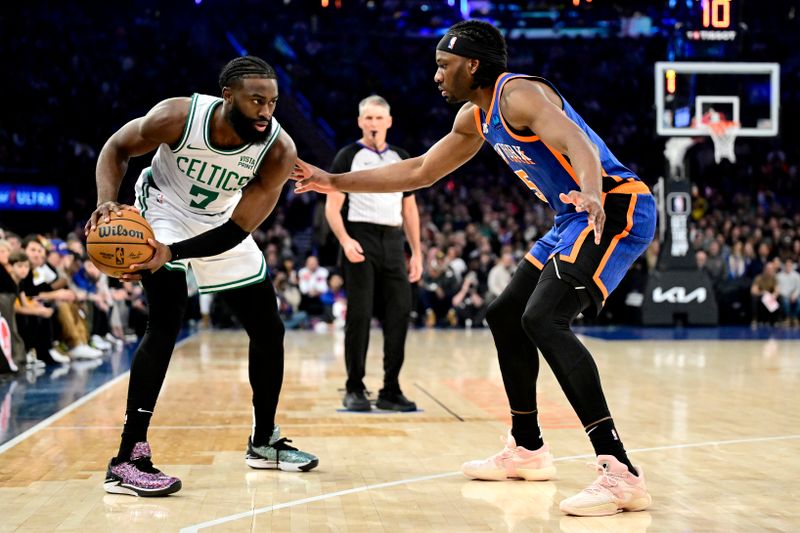 NEW YORK, NEW YORK - FEBRUARY 24:  Jaylen Brown #7 of the Boston Celtics is defended by Precious Achiuwa #5 of the New York Knicks during the first half at Madison Square Garden on February 24, 2024 in New York City. (Photo by Steven Ryan/Getty Images)