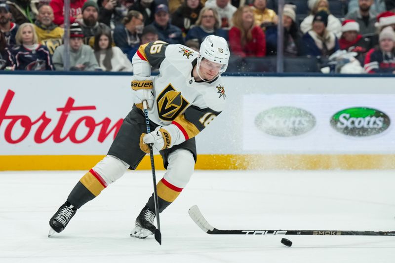 Dec 13, 2025; Columbus, Ohio, USA;  Vegas Golden Knights right wing Pavel Dorofeyev (16) skates with the puck around a stick on the ice during the game against the Columbus Blue Jackets in the second period at Nationwide Arena. Mandatory Credit: Aaron Doster-Imagn Images