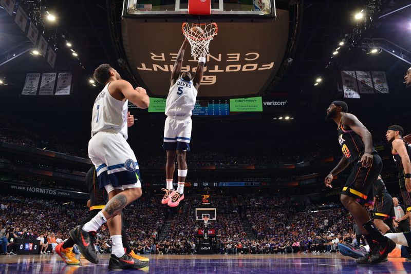 PHOENIX, AZ - APRIL 4: Anthony Edwards #5 of the Minnesota Timberwolves drives to the basket during the game against the Phoenix Suns during Round 1 Game 4 of the 2024 NBA Playoffs on April 4, 2023 at Footprint Center in Phoenix, Arizona. NOTE TO USER: User expressly acknowledges and agrees that, by downloading and or using this photograph, user is consenting to the terms and conditions of the Getty Images License Agreement. Mandatory Copyright Notice: Copyright 2024 NBAE (Photo by Barry Gossage/NBAE via Getty Images)