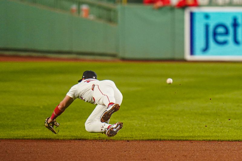 Sep 9, 2024; Boston, Massachusetts, USA; Boston Red Sox second baseman Romy Gonzalez (23) misses the ball against the Baltimore Orioles in the first inning at Fenway Park. Mandatory Credit: David Butler II-Imagn Images