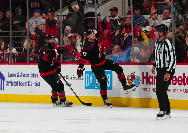 Jan 19, 2024; Raleigh, North Carolina, USA;  Carolina Hurricanes center Martin Necas (88) celebrates his goal against the Detroit Red Wings during the second period at PNC Arena. Mandatory Credit: James Guillory-USA TODAY Sports