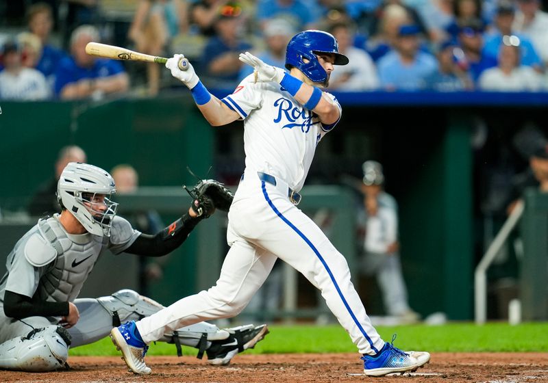 Sep 17, 2024; Kansas City, Missouri, USA; Kansas City Royals second baseman Michael Massey (19) hits an RBI single during the third inning against the Detroit Tigers at Kauffman Stadium. Mandatory Credit: Jay Biggerstaff-Imagn Images