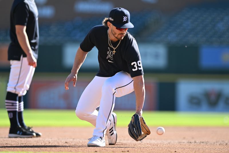 Oct 10, 2024; Detroit, Michigan, USA; Detroit Tigers shortstop Zach McKinstry (39) warms up before the game against the Cleveland Guardians during game four of the ALDS for the 2024 MLB Playoffs at Comerica Park. Mandatory Credit: Lon Horwedel-Imagn Images