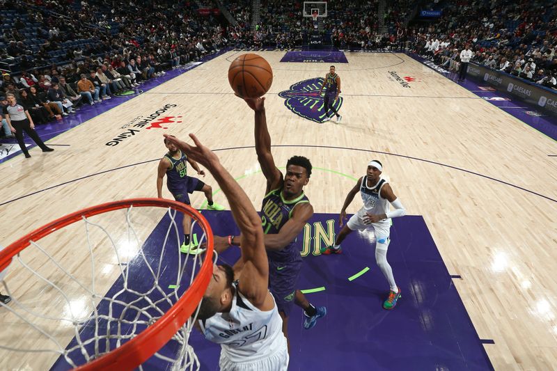 NEW ORLEANS, LA - JANUARY 7: Yves Missi #21 of the New Orleans Pelicans shoots the ball during the game against the Minnesota Timberwolves on January 7, 2025 at the Smoothie King Center in New Orleans, Louisiana. NOTE TO USER: User expressly acknowledges and agrees that, by downloading and or using this Photograph, user is consenting to the terms and conditions of the Getty Images License Agreement. Mandatory Copyright Notice: Copyright 2025 NBAE(Photo by Layne Murdoch Jr./NBAE via Getty Images)