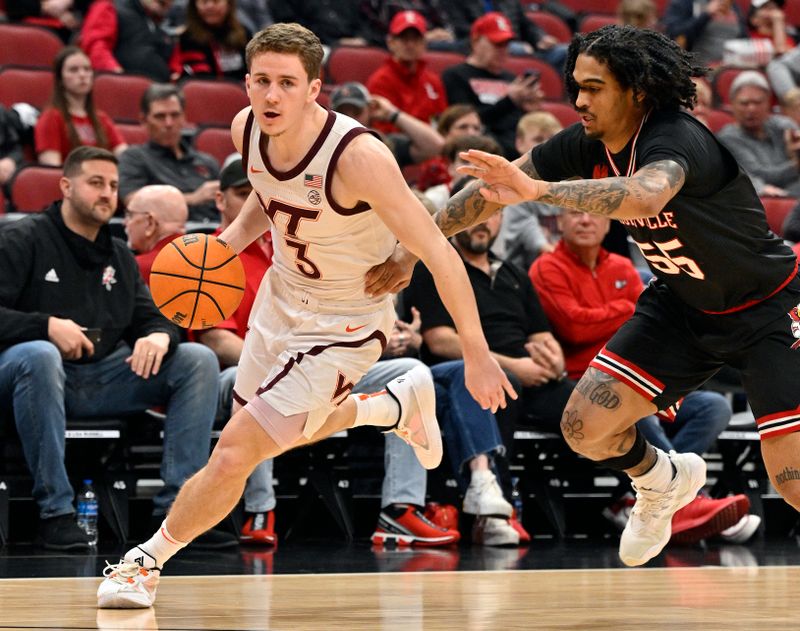 Mar 5, 2024; Louisville, Kentucky, USA; Virginia Tech Hokies guard Sean Pedulla (3) dribbles against Louisville Cardinals guard Skyy Clark (55) during the first half at KFC Yum! Center. Virginia Tech defeated Louisville 80-64. Mandatory Credit: Jamie Rhodes-USA TODAY Sports