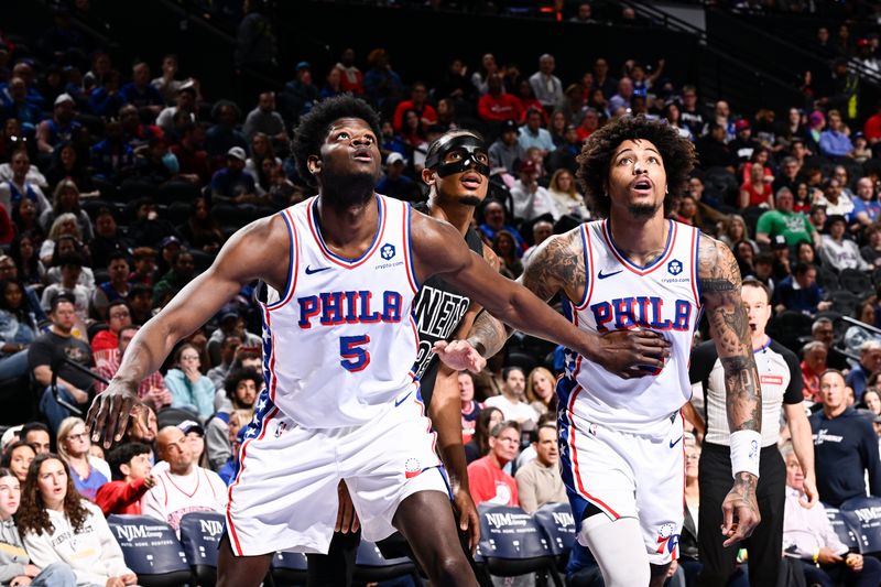 PHILADELPHIA, PA - APRIL 14:  Mo Bamba #5  and Kelly Oubre Jr. #9 of the Philadelphia 76ers plays defense against Nicolas Claxton #33 of the Brooklyn Nets on April 14, 2024 at the Wells Fargo Center in Philadelphia, Pennsylvania NOTE TO USER: User expressly acknowledges and agrees that, by downloading and/or using this Photograph, user is consenting to the terms and conditions of the Getty Images License Agreement. Mandatory Copyright Notice: Copyright 2024 NBAE (Photo by David Dow/NBAE via Getty Images)