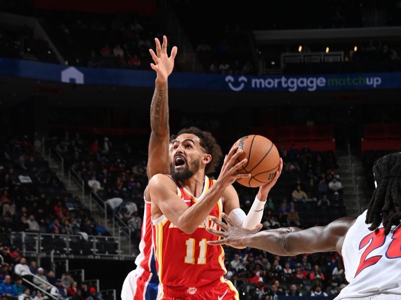 DETROIT, MI - FEBRUARY 3:  Trae Young #11 of the Atlanta Hawks drives to the basket during the game against the Detroit Pistons  on February 3, 2025 at Little Caesars Arena in Detroit, Michigan. NOTE TO USER: User expressly acknowledges and agrees that, by downloading and/or using this photograph, User is consenting to the terms and conditions of the Getty Images License Agreement. Mandatory Copyright Notice: Copyright 2025 NBAE (Photo by Chris Schwegler/NBAE via Getty Images)