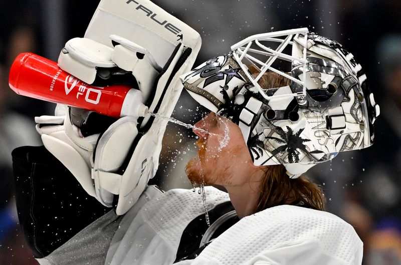 Apr 10, 2023; Los Angeles, California, USA;  Los Angeles Kings goaltender Joonas Korpisalo (70) sprays his face with water in the third period against the Vancouver Canucks at Crypto.com Arena. Mandatory Credit: Jayne Kamin-Oncea-USA TODAY Sports