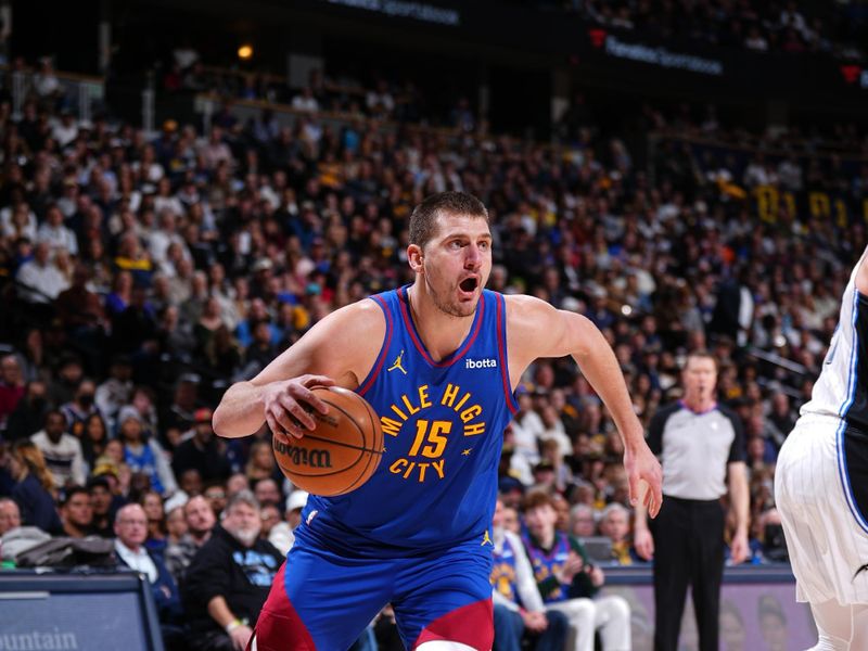 DENVER, CO - JANUARY 5: Nikola Jokic #15 of the Denver Nuggets drives to the basket during the game against the Orlando Magic on January 5, 2024 at the Ball Arena in Denver, Colorado. NOTE TO USER: User expressly acknowledges and agrees that, by downloading and/or using this Photograph, user is consenting to the terms and conditions of the Getty Images License Agreement. Mandatory Copyright Notice: Copyright 2024 NBAE (Photo by Garrett Ellwood/NBAE via Getty Images)