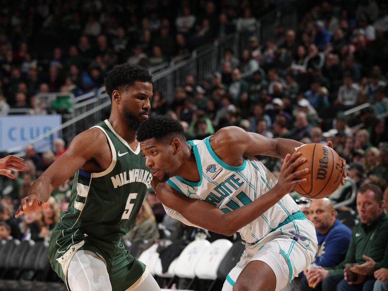 MILWAUKEE, WI - FEBRUARY 9: Brandon Miller #24 of the Charlotte Hornets handles the ball during the game against the Milwaukee Bucks on February 9, 2024 at the Fiserv Forum Center in Milwaukee, Wisconsin. NOTE TO USER: User expressly acknowledges and agrees that, by downloading and or using this Photograph, user is consenting to the terms and conditions of the Getty Images License Agreement. Mandatory Copyright Notice: Copyright 2024 NBAE (Photo by Gary Dineen/NBAE via Getty Images).