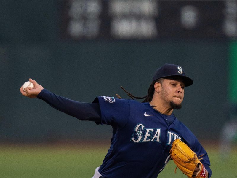 Sep 19, 2023; Oakland, California, USA; Seattle Mariners starting pitcher Luis Castillo (58) delivers a pitch against the Oakland Athletics during the first inning at Oakland-Alameda County Coliseum. Mandatory Credit: Neville E. Guard-USA TODAY Sports