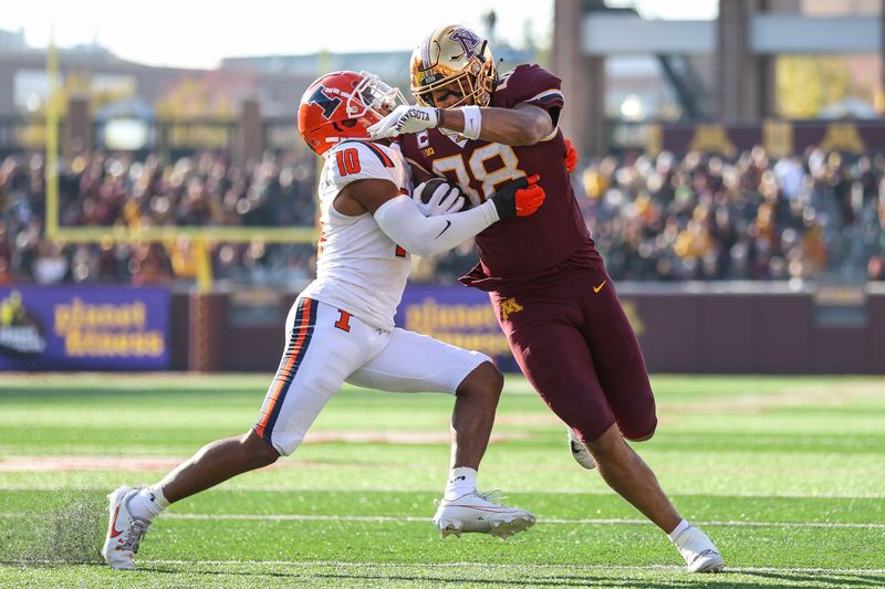 Nov 4, 2023; Minneapolis, Minnesota, USA; Minnesota Golden Gophers tight end Brevyn Spann-Ford (88) runs the ball for a touchdown while Illinois Fighting Illini defensive back Miles Scott (10) defends during the first half at Huntington Bank Stadium. Mandatory Credit: Matt Krohn-USA TODAY Sports