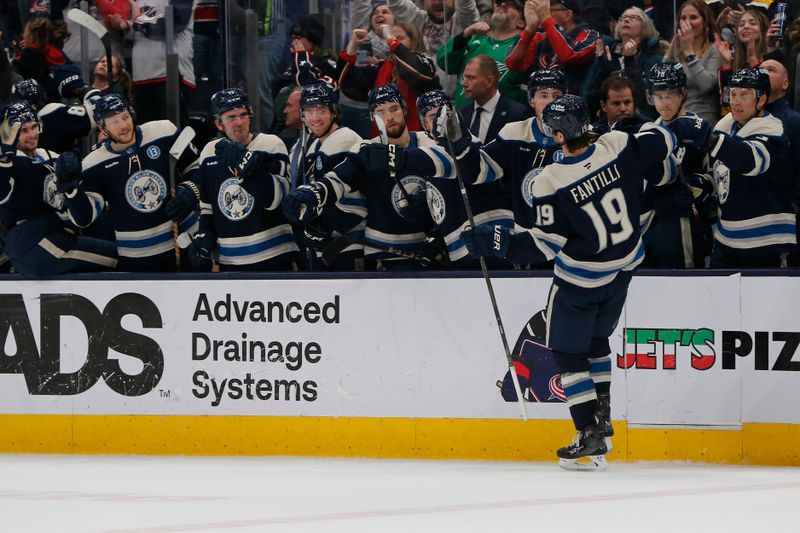 Dec 31, 2024; Columbus, Ohio, USA; Columbus Blue Jackets center Adam Fantilli (19) celebrates his shootout game winning goal during the shootout against the Carolina Hurricanes at Nationwide Arena. Mandatory Credit: Russell LaBounty-Imagn Images