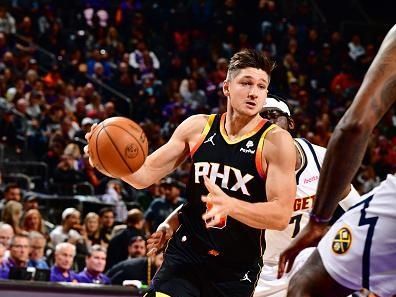 PHOENIX, AZ - DECEMBER 1: Grayson Allen #8 of the Phoenix Suns drives to the basket during the game against the Denver Nuggets on December 1, 2023 at Footprint Center in Phoenix, Arizona. NOTE TO USER: User expressly acknowledges and agrees that, by downloading and or using this photograph, user is consenting to the terms and conditions of the Getty Images License Agreement. Mandatory Copyright Notice: Copyright 2023 NBAE (Photo by Barry Gossage/NBAE via Getty Images)