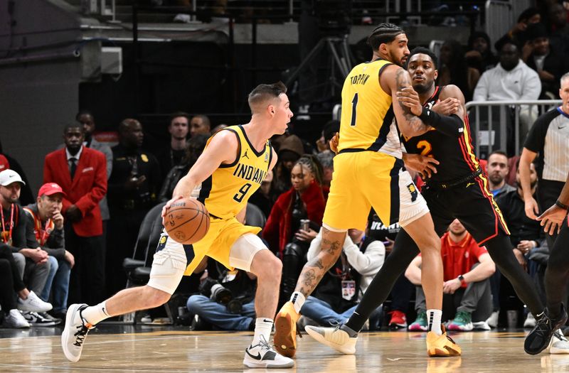 ATLANTA, GEORGIA - JANUARY 12:  T.J. McConnell #9  of the Indiana Pacers dribble the ball during the game against the Atlanta Hawks on January 12, 2024 at State Farm Arena in Atlanta, Georgia. NOTE TO USER: User expressly acknowledges and agrees that, by downloading and or using this photograph, User is consenting to the terms and conditions of the Getty Images License Agreement. (Photo by Paras Griffin/Getty Images)